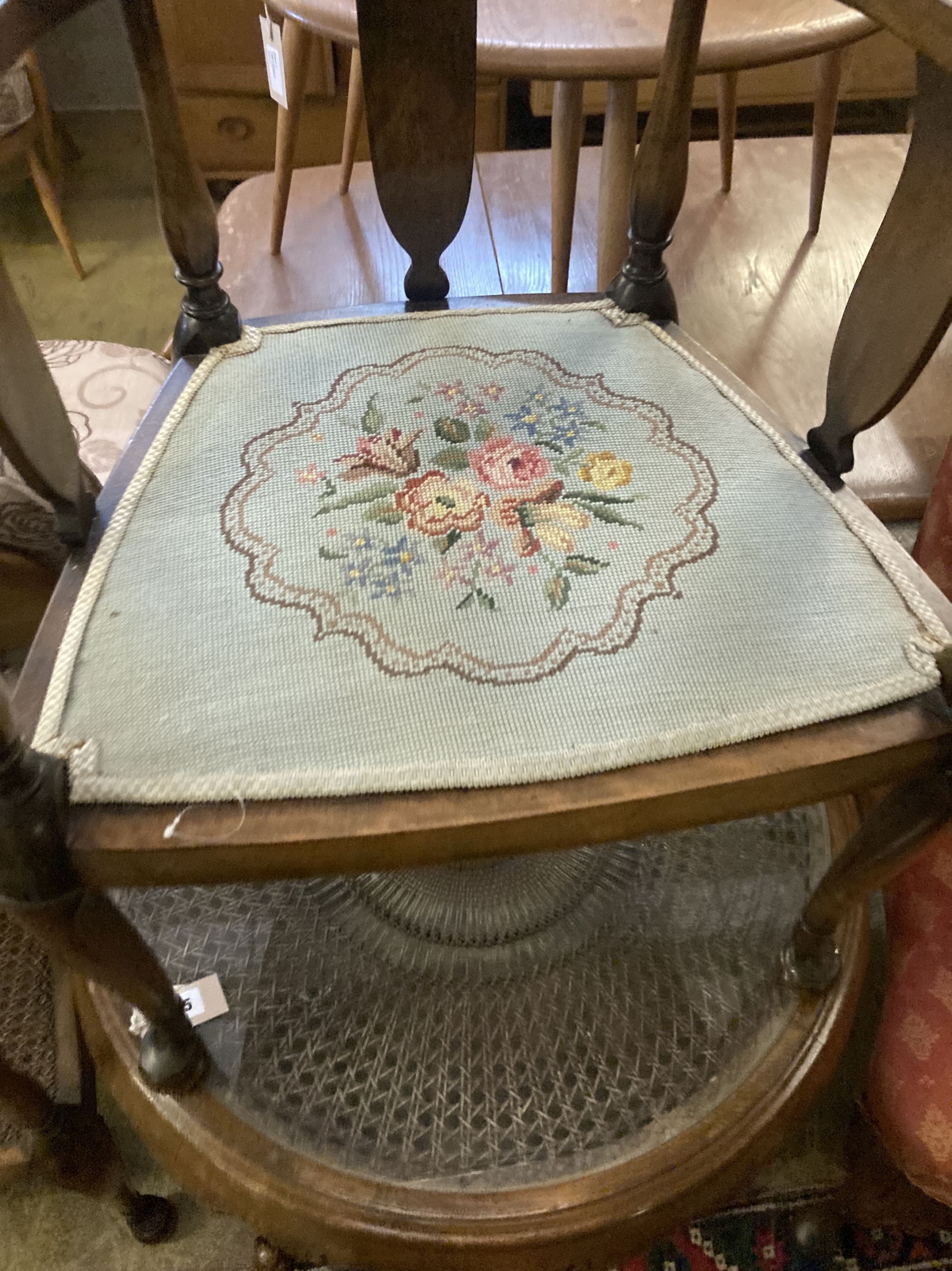 A 1920s circular caned beech occasional table, diameter 76cm, together with a pair of elbow chairs, one with a later tapestry seat